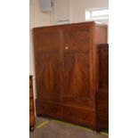 An Art Deco mahogany and pine press cupboard, handwritten label to the interior, "Token Hand Made