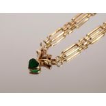 A 9ct gold necklace, having heart shaped pendant set with green stone, approx. 7.5gms total weight