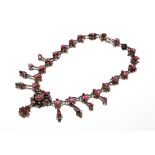 An antique red stone set pendant and necklace