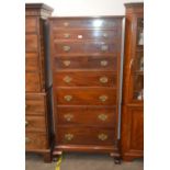 An early 20th Century mahogany chest of tall proportions, fitted eight graduated drawers raised on