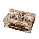 A 19th Century Sheffield plated desk stand, having gadrooned and shell decorated border, fitted with