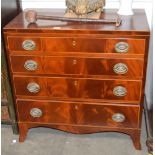 A Georgian mahogany and box wood strung chest, of four long graduated drawers raised on a shaped