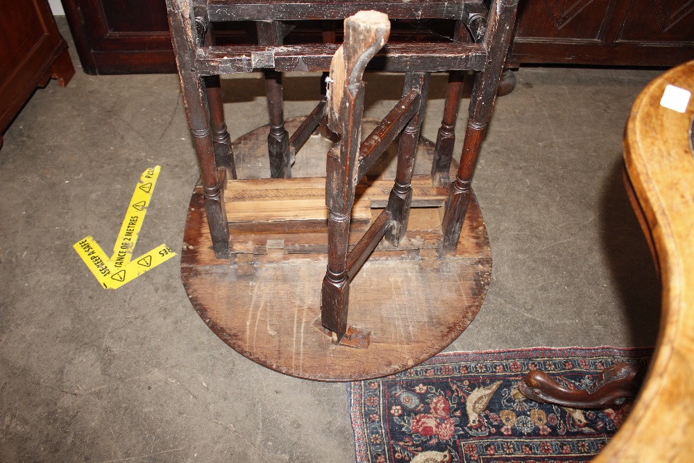 An 18th Century oak gate leg table, raised on turned supports terminating in Braganza type feet, - Image 19 of 23