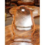 A mahogany skeleton framed swing toilet mirror, with turned roundel decoration, 54cm high x 40cm