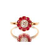 An 18ct gold and platinum ruby and diamond set cluster ring