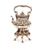 A mid-Victorian plated five o'clock tea kettle on stand, ornately decorated foliated scrolls, the