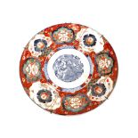 A large Japanese Imari charger, decorated in the traditional palette, 46cm dia.