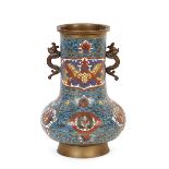 A Chinese bronze and cloisonné baluster vase, flanked by beast scroll handles, 30cm high