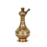 A large antique brass bottle shaped hookah base, with fine foliate overall decoration, 33.5cm
