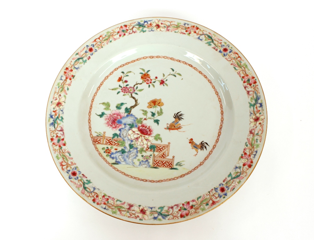 An 18th Century Chinese famille rose dish, with fighting cock decoration, 35cm dia.