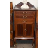 An Edwardian mahogany satin wood strung and crossbanded tray top music cabinet, fitted three drop