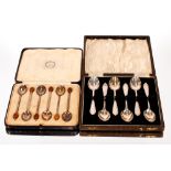 A cased set of six silver bean topped coffee spoons; and a cased set of six silver teaspoons
