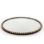 An ebonised blue glass and enamel decorated oval wall mirror, bearing label verso, Charles Carline