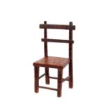 A small rustic carved wooden chair, the seat inscribed "For My Pet"