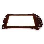 A 19th Century mahogany fret carved wall mirror, in the Chippendale manner, 99cm x 54cm in extremes