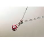 An 18tct white gold necklace, the pendant set ¼ carat diamond, rubies and smaller diamonds, 3.2gms