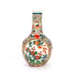 A small Canton famille rose decorated baluster vase, four character mark to base, 13cm high