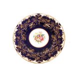A set of ten Royal Worcester porcelain cabinet plates, decorated with a hand painted central roundel