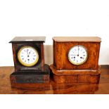 A late Victorian light oak mantel clock, having eight day movement striking on a bell, white