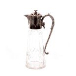 A cut glass and electroplated mounted claret jug, with foliate engraved decoration and scroll