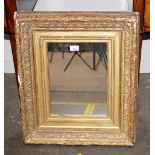 A 19th Century gilt framed wall mirror, having ribbon tied and foliate decoration, 59cm x 51cm