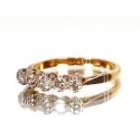An 18ct gold and platinum ring set five small diamonds, approx. total weight 3gms