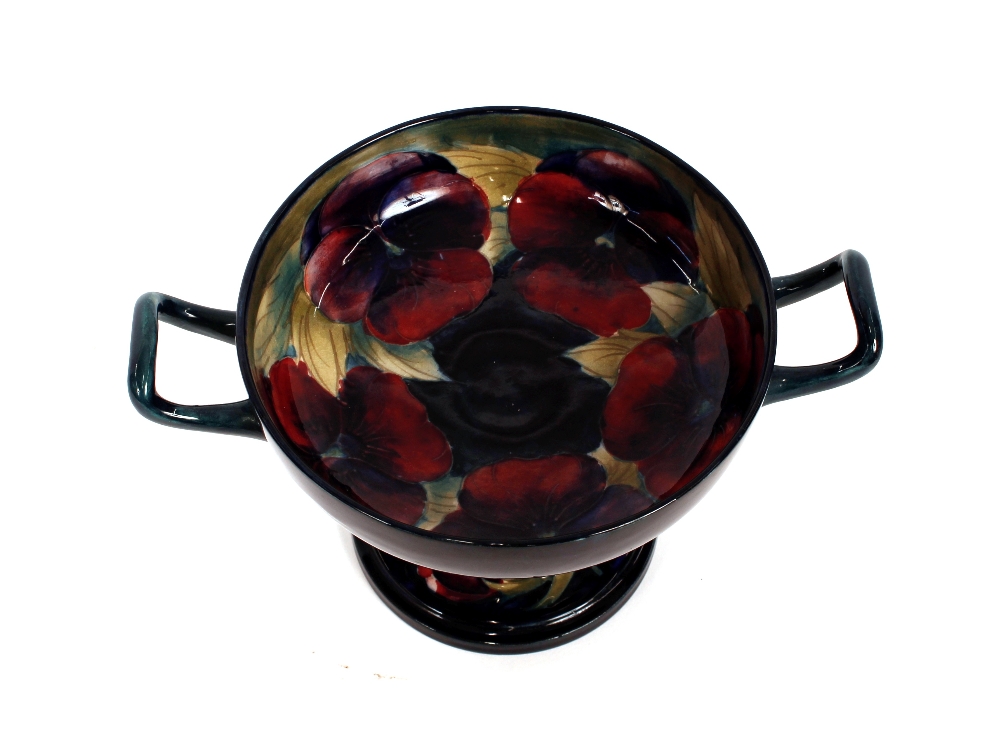 A Moorcroft Tazza, signed W Moorcroft "Pansy" pattern, marked M57, 23cm dia. overall, 14cm high - Image 2 of 3