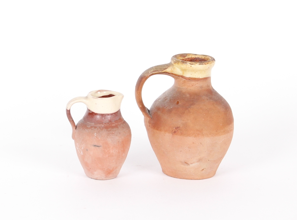 Two 19th Century Verwood pottery jugs, 14cm and 10cm respectively