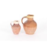 Two 19th Century Verwood pottery jugs, 14cm and 10cm respectively