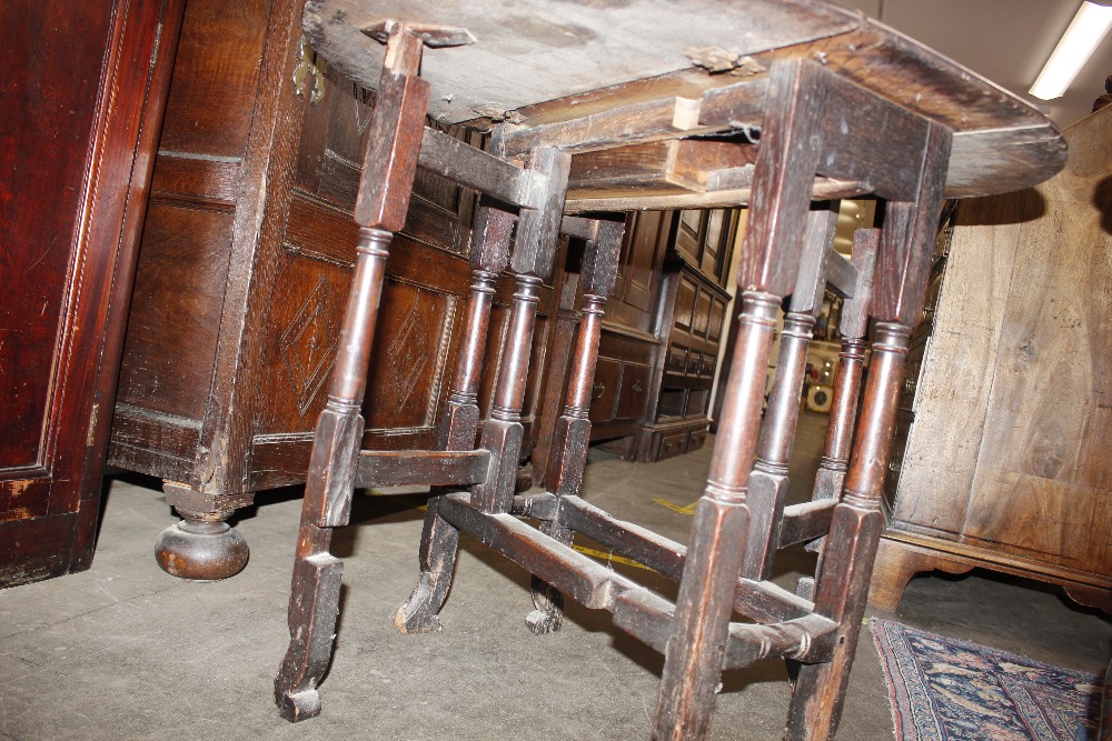 An 18th Century oak gate leg table, raised on turned supports terminating in Braganza type feet, - Image 17 of 23