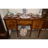 A Regency mahogany serpentine fronted sideboard, fitted central drawer flanked by cellarette