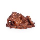 A finely carved 19th Century Chinese figure, of a reclining Putai, 26cm