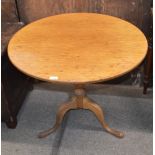 A 19th Century mahogany circular snap top occasional table, raised on turned baluster column and