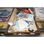 A wooden tray containing various mixed ephemera in