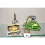 An Art Deco style green glass perfume atomiser; a small cased Stratton lipview; and a continental wh