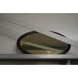 An oval bevel edged wall mirror