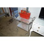 A two tier tea trolley and a retro magazine rack