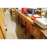 A late Victorian golden oak sideboard fitted three