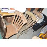 A set of three elm seated slat back dining chairs