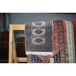 An approx 2'2" x 1'6" Eastern patterned rug