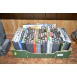 A box of various DVD's and video games