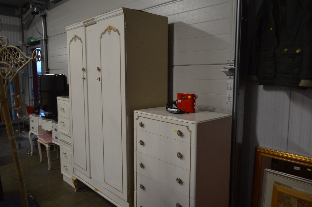 A bedroom suite comprising of a two door wardrobe;