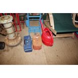 A plastic box containing light bulbs, a fuel can,