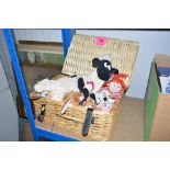 A wicker basket and contents of soft toys to inclu