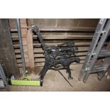 A pair of metal bench ends