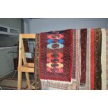 An approx 4'4" x 2' red Eastern patterned rug
