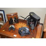 Four pairs of binoculars, two with case