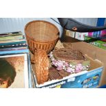 A box of various small wicker baskets