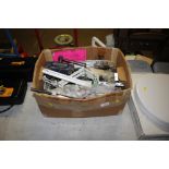 A box containing various metal fittings, bench vice