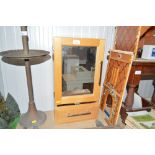 A mirror fronted bathroom cabinet